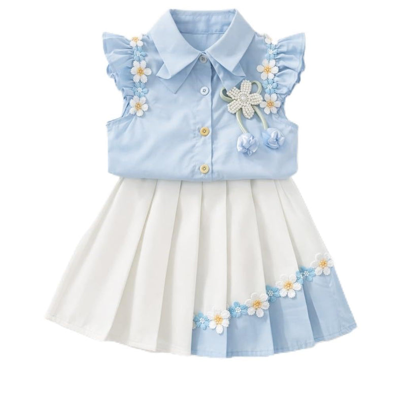 A baby girl's sleeveless collared dress with a light blue top featuring ruffled sleeves, gold buttons, and embroidered white and blue flowers, paired with a pleated white skirt with matching floral trim.